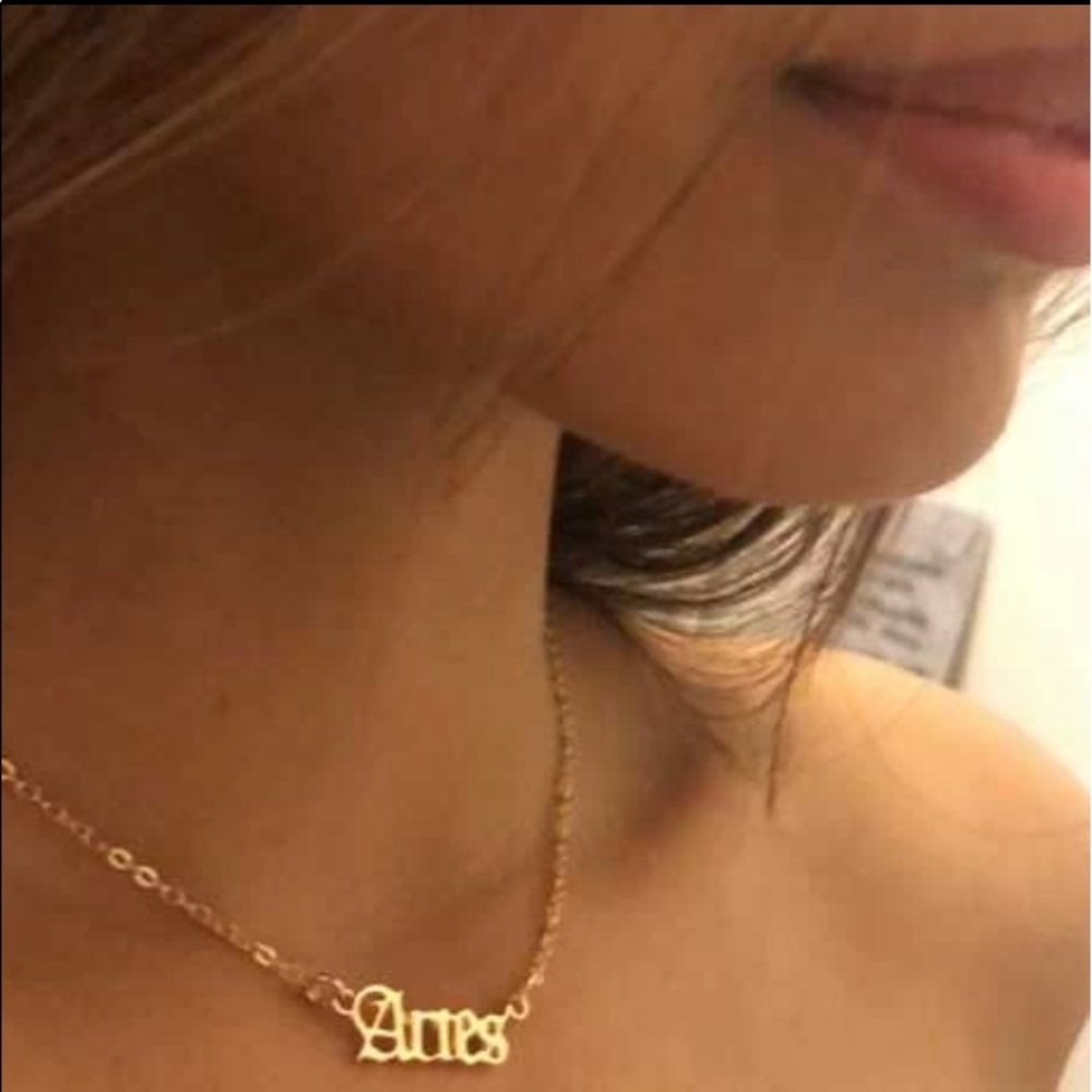 Gold sign necklace